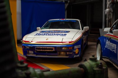 Rothmans Porsche 924 front view, Shell and Pirelli livery, historic rally car indoor exhibition photography