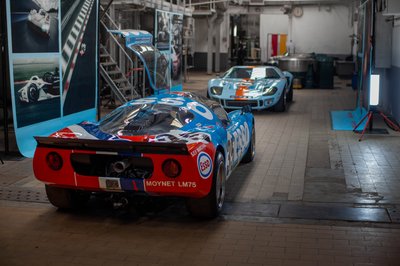 Porsche 908 Esso Moynet LM75 rear view alongside Ford GT40 Gulf number 10, historic endurance racing cars exhibition