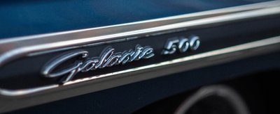 Chrome Galaxie 500 badge close-up detail on blue bodywork, classic American car macro photography