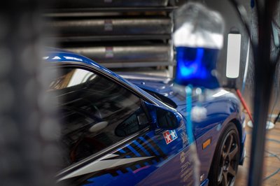 Nissan Skyline R33 GTS-T blue side detail with Tamiya sticker, JDM drift car close-up photography